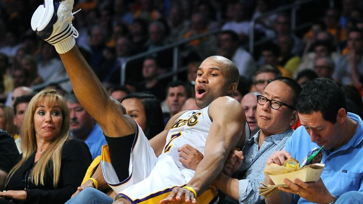 Appetize's founders were frustrated that they couldn't use an app to get food delivered to their seats at Staples Center during a Lakers game in 2011. So they invented one. Above, Derek Fisher falls into the seats after chasing a loose ball in a 2011 game against the Hornets.