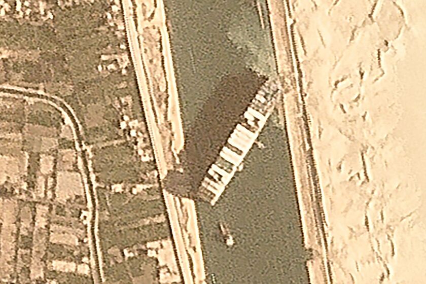 A satellite image shows the cargo ship Ever Given wedged in the Suez Canal near Suez, Egypt, on Thursday.