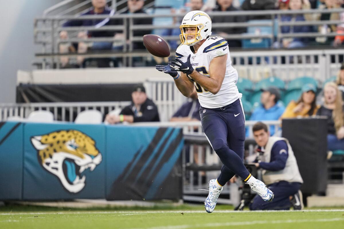 Chargers tight end Hunter Henry catches a pass for a touchdown during the second quarter of a game against the Jacksonville Jaguars last season.