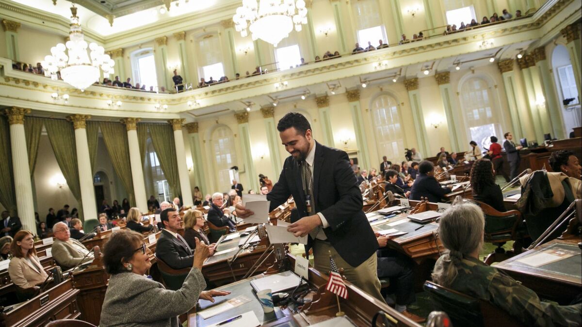 Andres Ramos collect the ballots voted by the members of the Electoral College at the State Capitol in Sacramento, Calif. on Dec. 19, 2016.