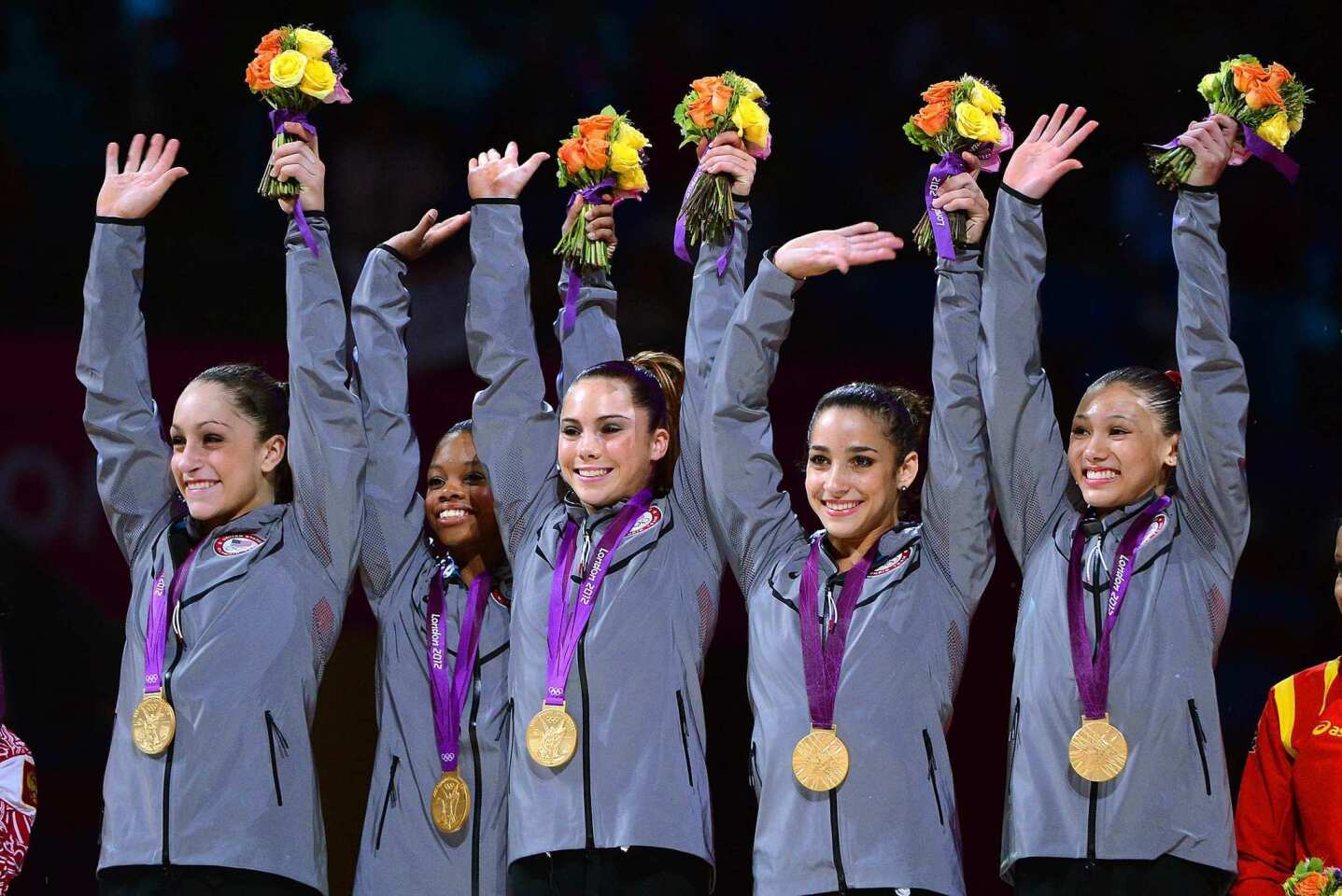 USA gymnasts, from left, Jordyn Wieber, Gabrielle Douglas, McKayla Maroney, Alexandra Raisman and Kyla Ross celebrate their gold medal in the women's team final.