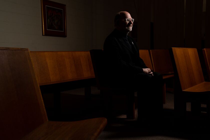 LOS ANGELES, CA - APRIL 04: Father Chris Ponnet poses for a portrait at St. Camillus Catholic Center For Pastoral Care on Saturday, April 4, 2020 in Los Angeles, CA. During the coronavirus pandemic, priests and chaplains are still continuing to do work in hospitals either as chaplains or as volunteers who administer sacraments to patients. (Kent Nishimura / Los Angeles Times)