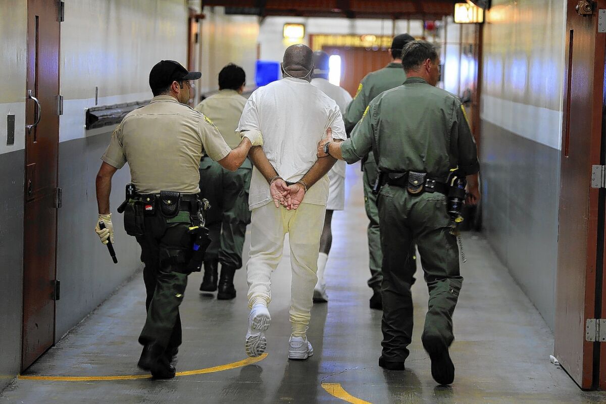 Two inmates are walked from their cells to the medical unit at Pelican Bay State Prison in Crescent City. State prison officials adopted new policies addressing use of force against mentally ill inmates.