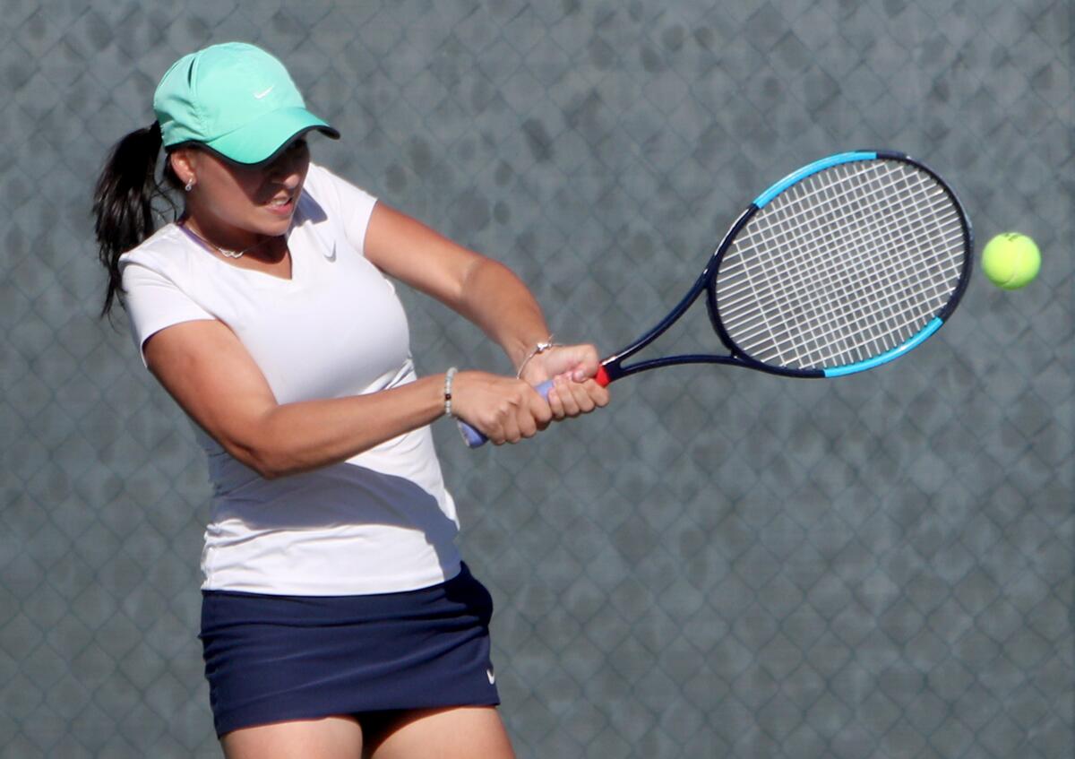 Crescenta Valley High's Melissa Rosa Muradoglu returns a shot during Tuesday's Pacific League match against Glendale.