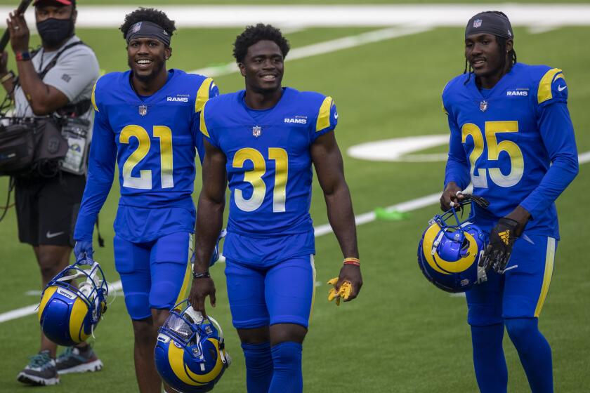 INGLEWOOD, CA - AUGUST 22: Rams Dont'e Deayon, No. 21, left, Darious Williams, No. 31, center, and David Long Jr., No. 25, right, take the field for scrimmage at SoFi Stadium Saturday, Aug. 22, 2020 in Inglewood, CA. Brian van der Brug / Los Angeles Times)