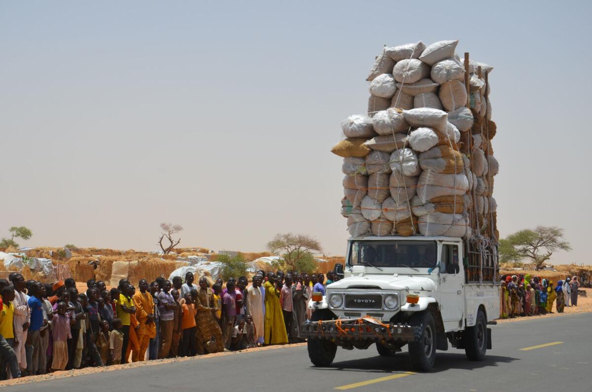 An overloaded car travels through the Assaga refugee camp in Diffa in May 2016, close to the Niger-Nigeria border. Chief of Humanitarian Operations of the UN, Stephen O'Brien, has vowed to raise funds at the World Humanitarian Summit for "significant" help to the more than 240,000 refugees displaced by Boko Haram in camps in south-east Niger.