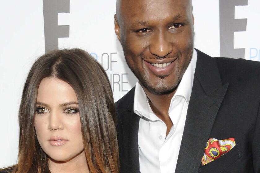 Khloe Kardashian and Lamar Odom, shown in April 2012, have called off their divorce.