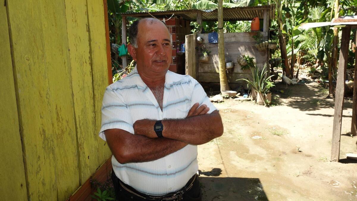 Juan Pablo Aguirre, a farmer in Filipinas, Colombia, worked with Juan Vicente Carvajal on the Community Action Board, which solved local disputes and identified needed public works.