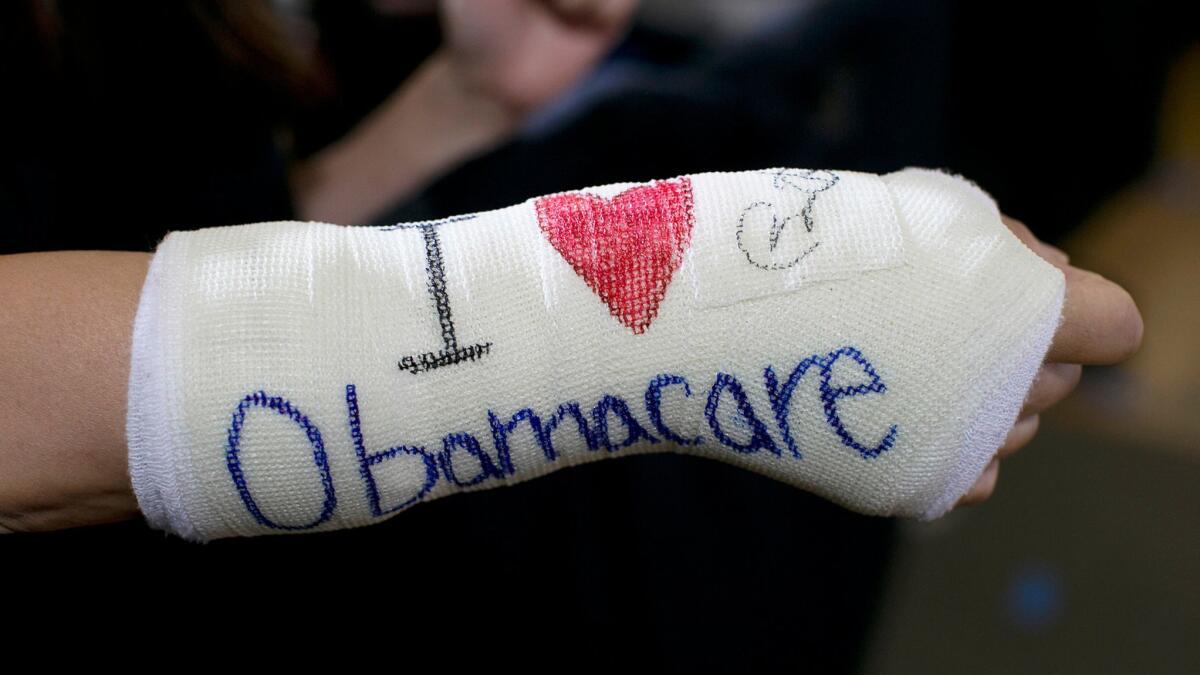 A supporter of the Affordable Care Act at a speech by then-President Obama on Oct. 30, 2013.
