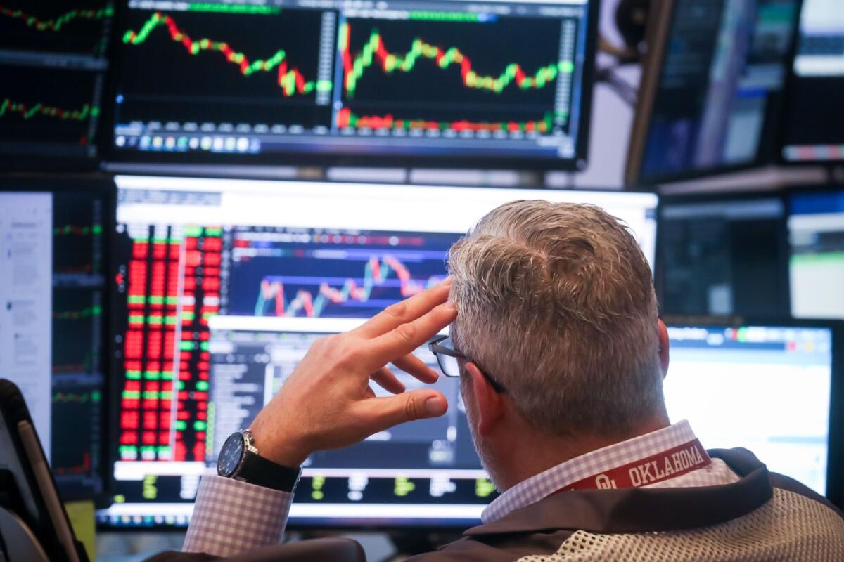 A trader working on the floor of the New York Stock Exchange