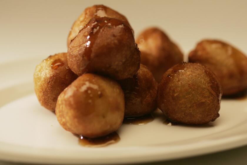 An elegant mound of tiny Cabrales blue cheese beignets drizzled with a peppery honey gastrique.