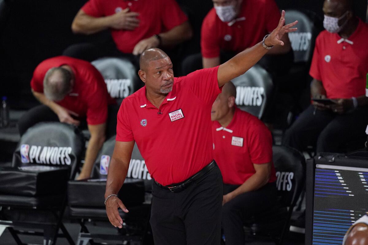 Former Clippers coach Doc Rivers gestures during a game.