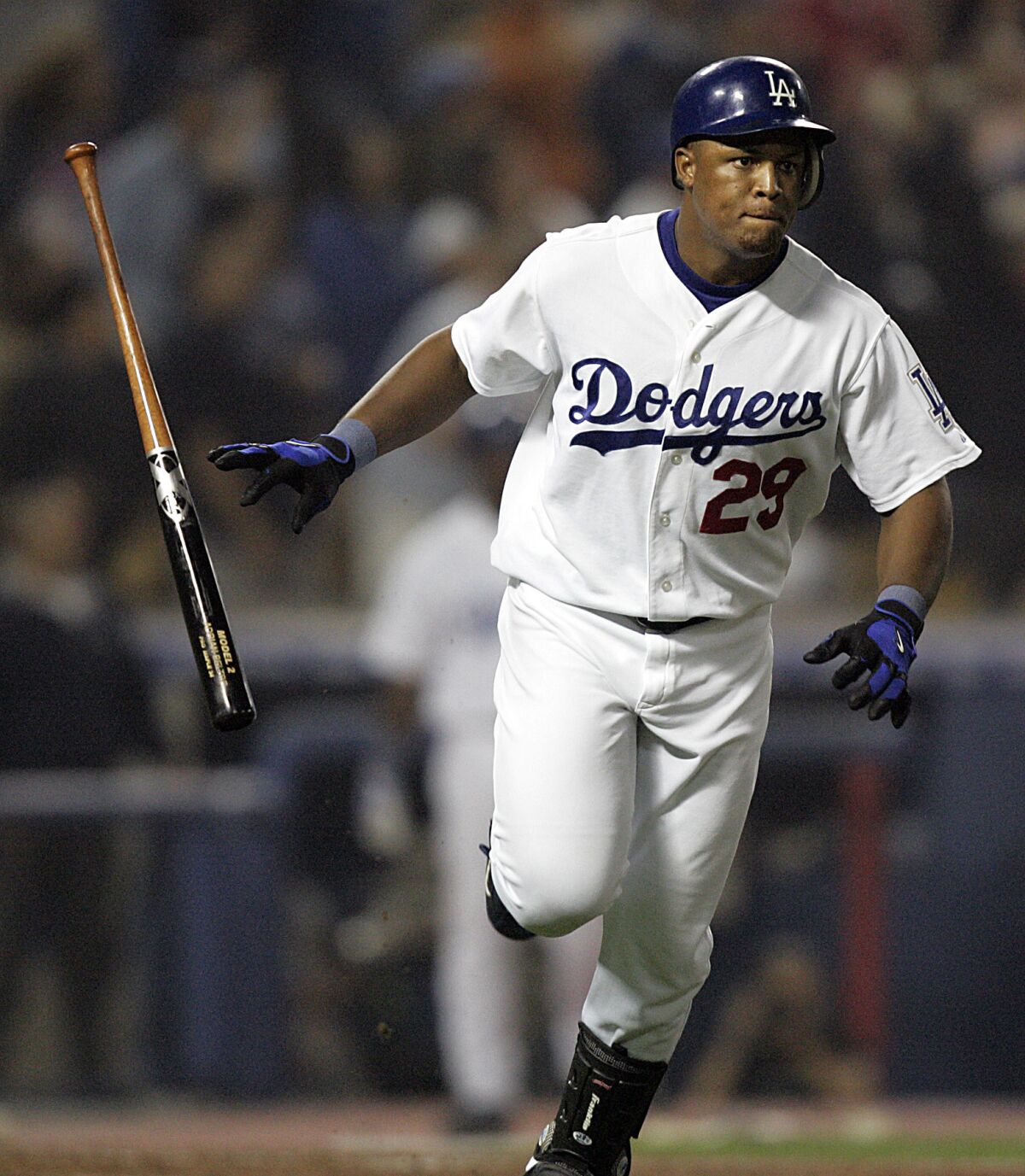 Dodgers' Adrian Beltre flips the bat after hitting a grand slam against the Colorado Rockies on Sept. 27, 2004