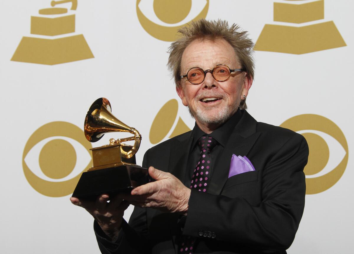 Paul Williams, a collaborator on Daft Punk's album "Random Access Memories," shows off his Grammy for album of the year.