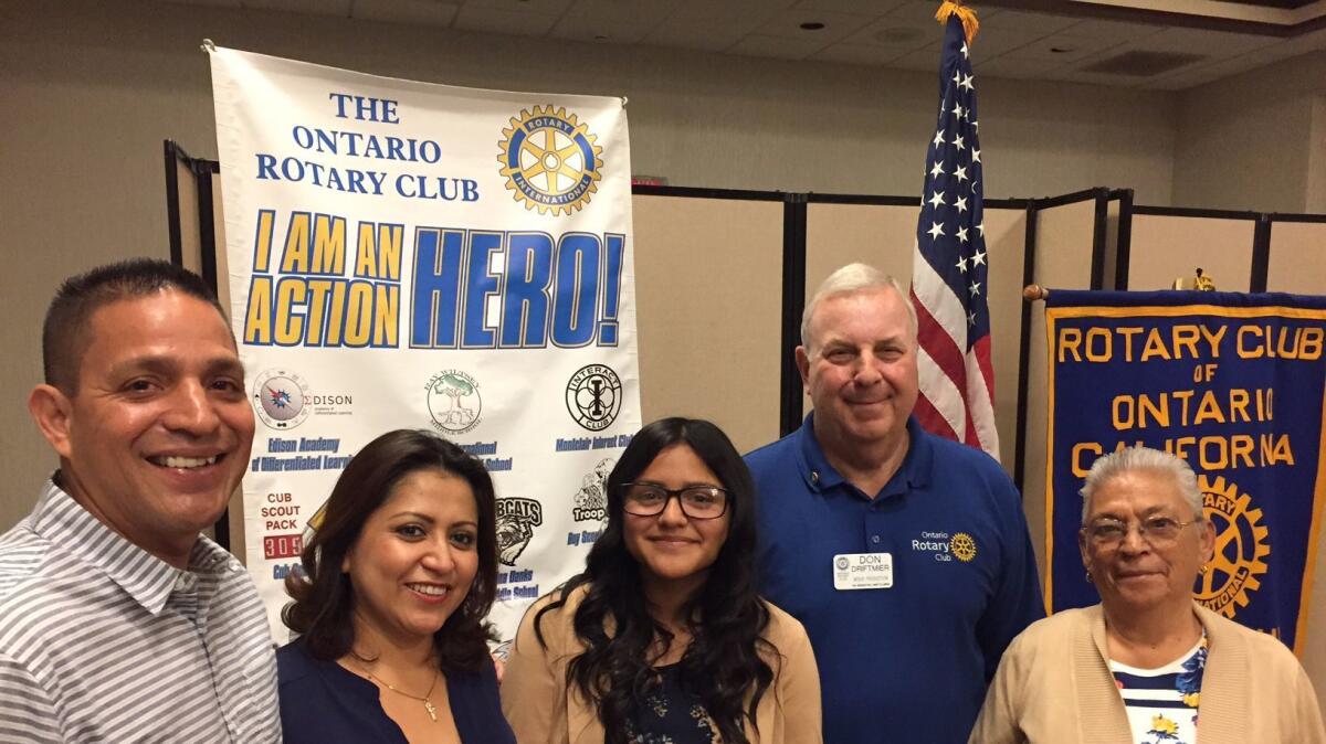 Student Daniela Balvaneda, center, with parents Carolos and Blanca, left, grandmother Gloria, right, and Rotarian Don Driftmier.