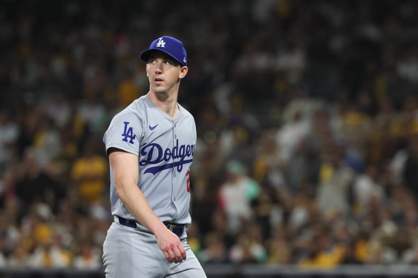 SAN DIEGO, CALIFORNIA - OCTOBER 08: Walker Buehler #21 of the Los Angeles Dodgers walks off the field after giving up no runs during the fifth inning in game three of the National League Division Series against the San Diego Padres at Petco Park on Tuesday, Oct. 8, 2024 in San Diego. (Robert Gauthier / Los Angeles Times)