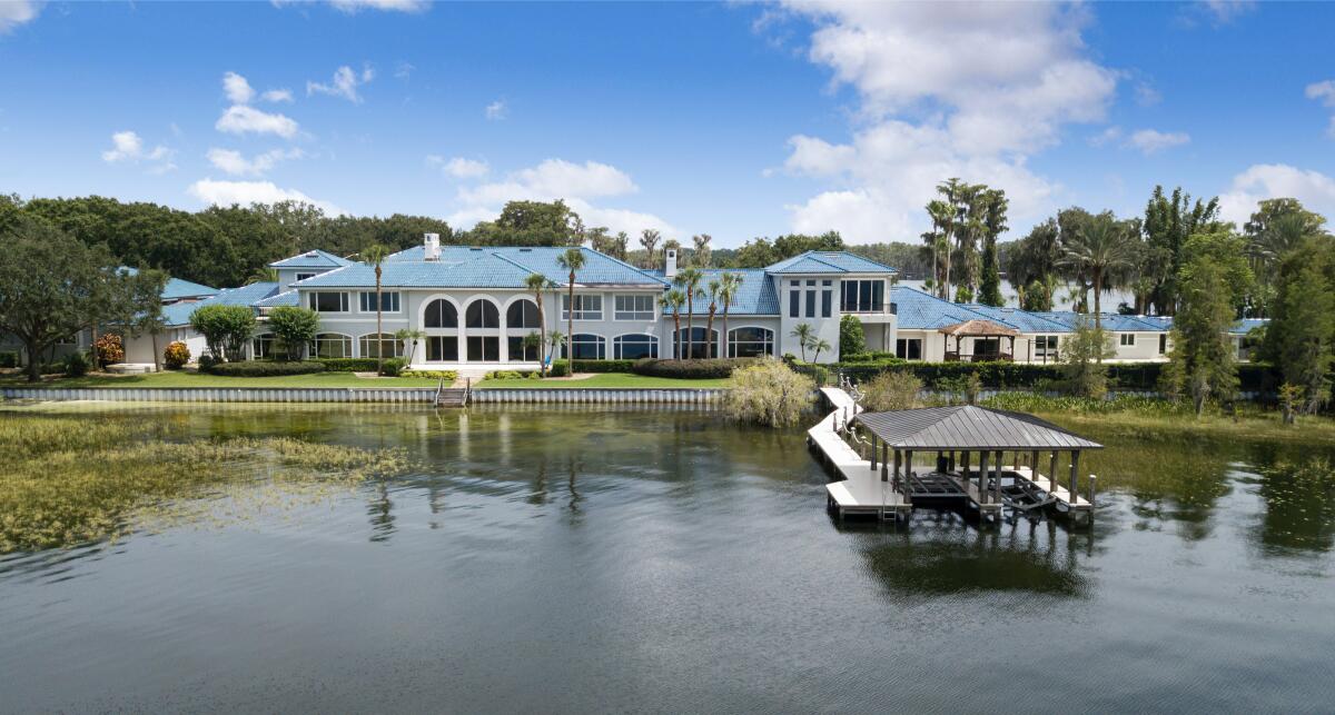 The 31,000-square-foot home includes 12 bedrooms, 15 bathrooms and a 6,000-square-foot indoor basketball court.