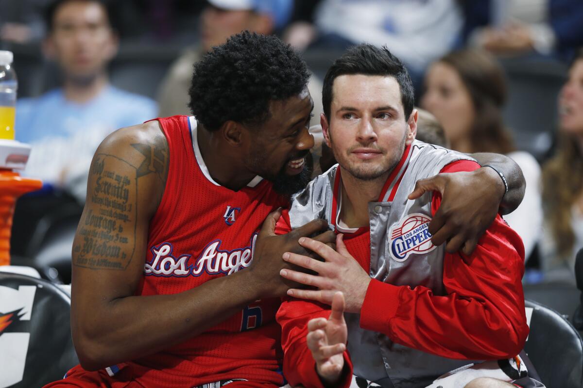 Clippers center DeAndre Jordan, left, jokes with guard J.J. Redick during the fourth quarter of a 107-92 victory on April 4 in Denver.