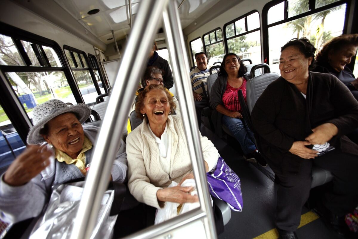 Anizeta Lopez, 77, front row left, Eloisa Ruiz, 75, Josefina Gonzalez, 73, and Clarita Trujillo, 79, enjoy one another's company while riding on the Dial-A-Ride shuttle bus in Bell Gardens.