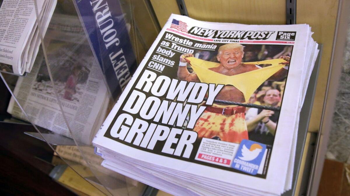 Copies of the New York Post with an illustration of President Trump as a professional wrestler on the front page sit at a newsstand in New York on July 3.