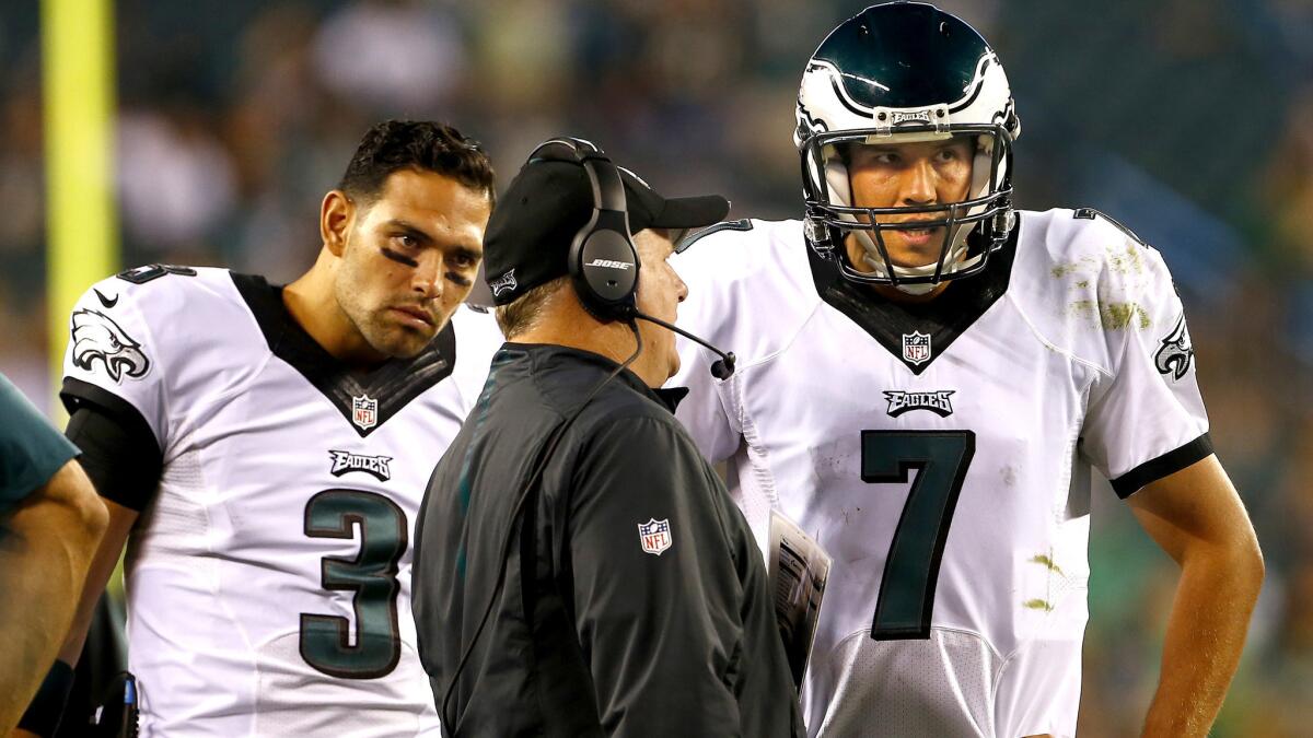 Eagles Coach Chip Kelly, talking to quarterbacks Sam Bradford (7) and Mark Sanchez (3) is off to an unexpected 0-2 start this season.