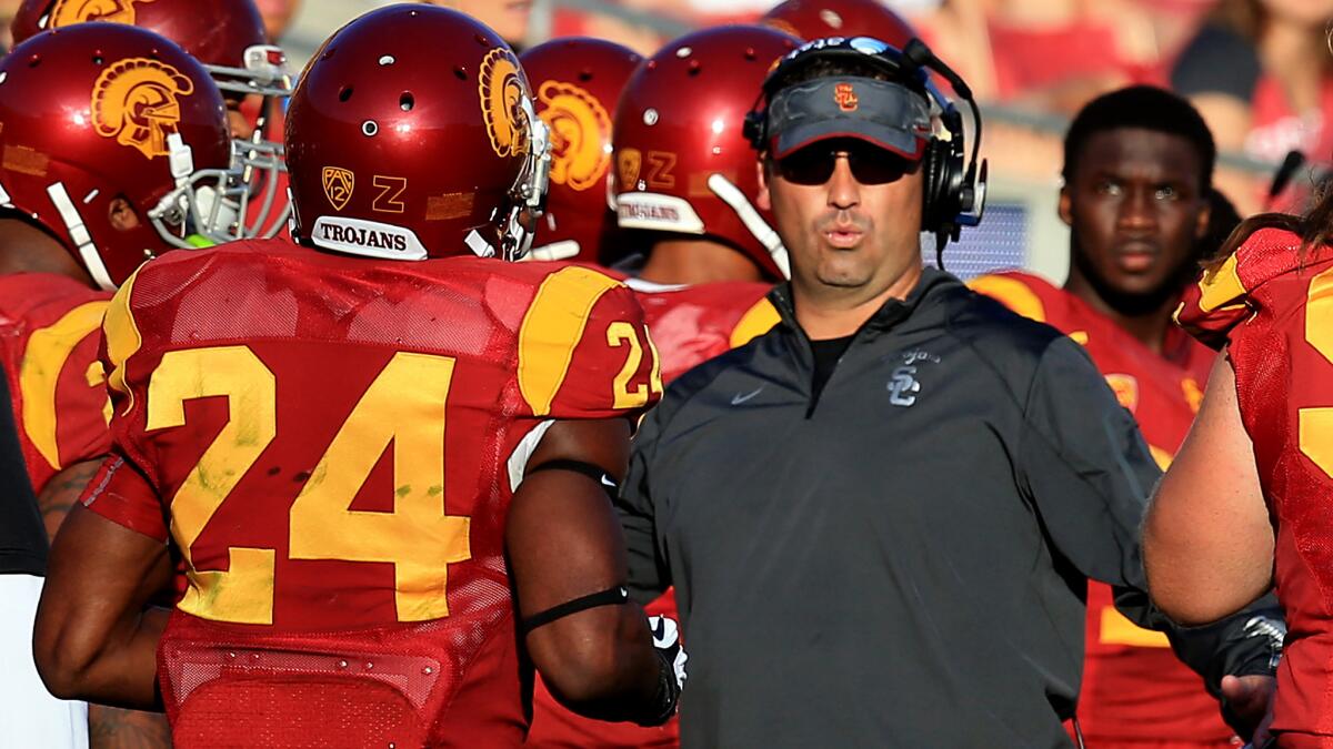 USC Coach Steve Sarkisian watches from the sideline during the closing moments of the Trojans' 49-14 win over Notre Dame on Nov. 29.