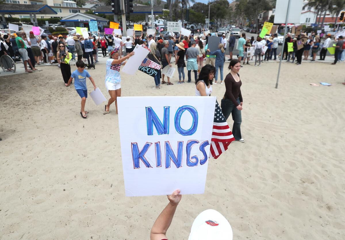Thousands gathered Saturday for "No Kings" protests, including this one at Main Beach in Laguna Beach.