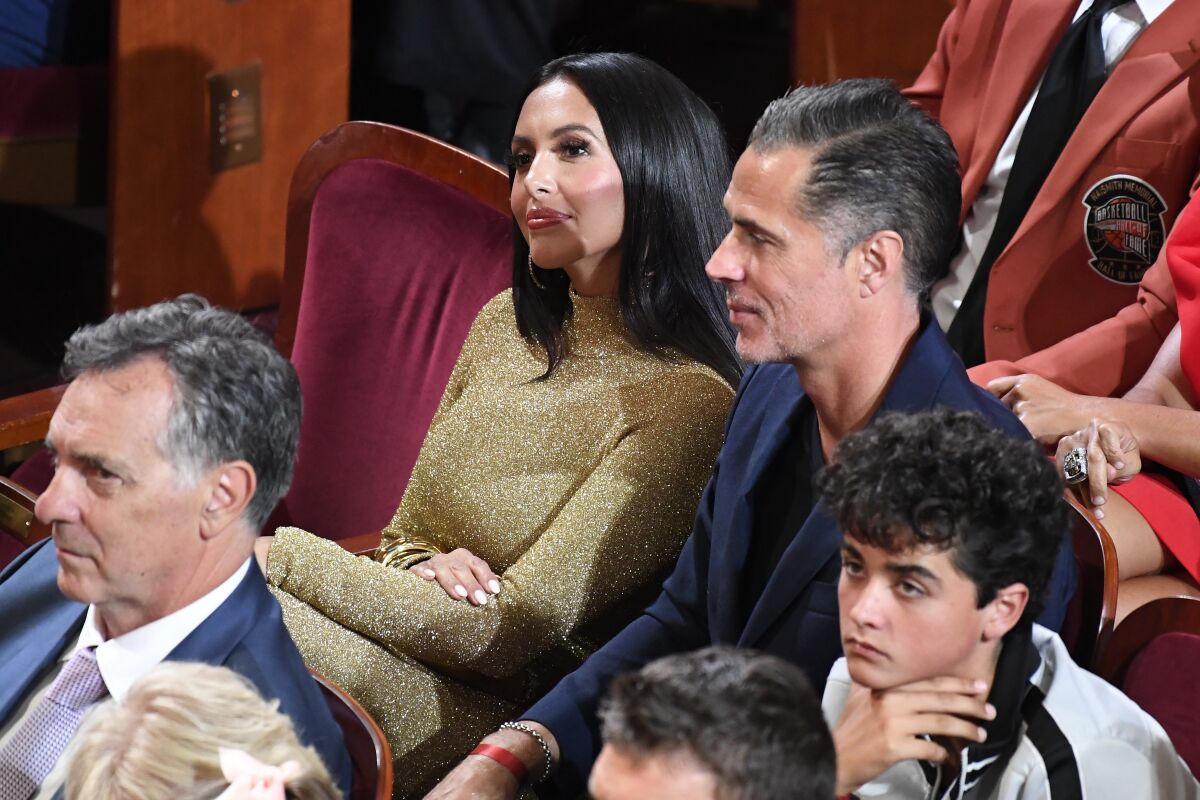 Vanessa Bryant, top left, sits next to Lakers general manager Rob Pelinka at the Basketball Hall of Fame.