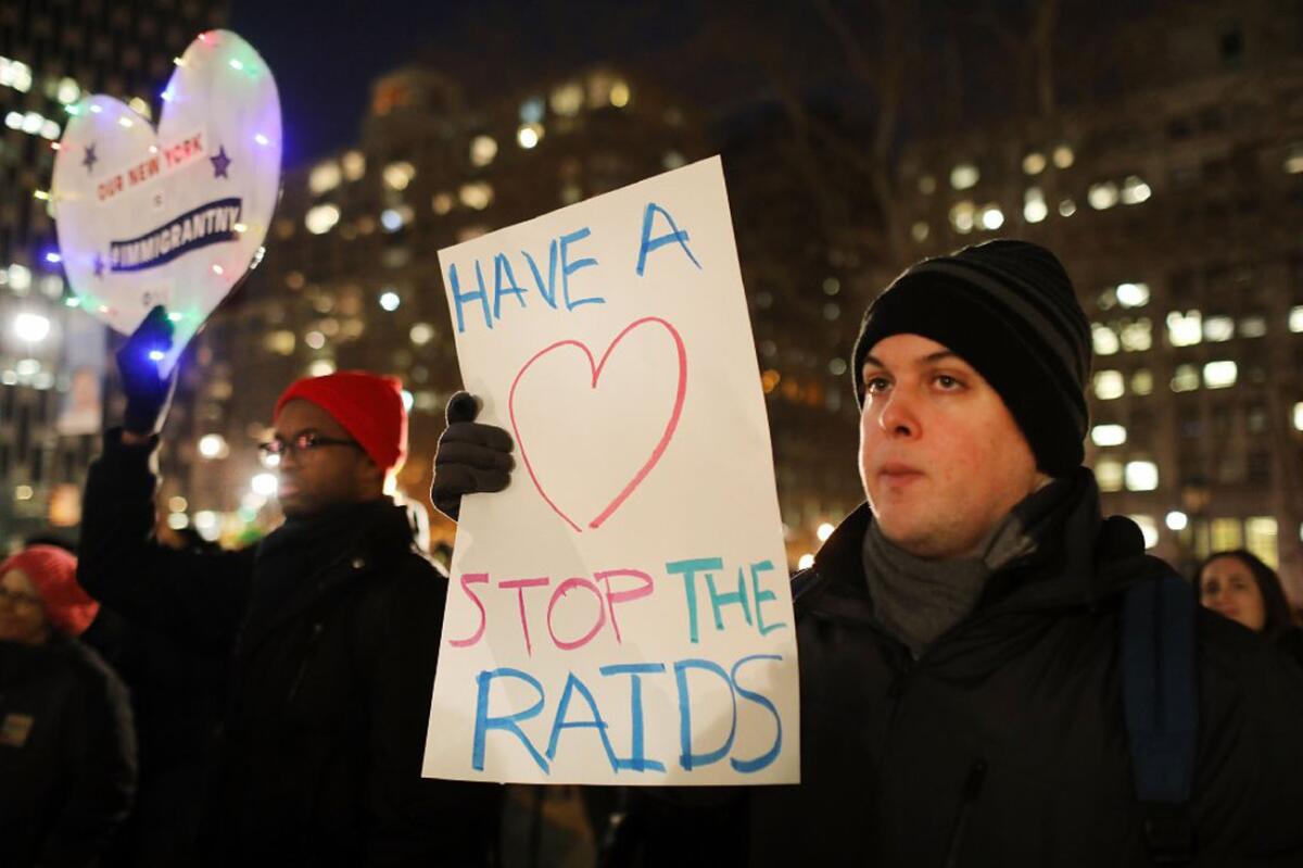 People attend a Valentine's Day rally against immigration raids in New York on Feb. 14, 2017,