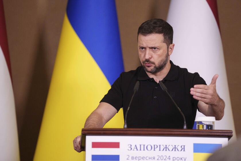 Ukrainian President Volodymyr Zelenskyy speaks during a joint press conference with Netherlands' Prime Minister Dick Schoof in Zaporizhzhia, Ukraine, Monday Sept. 2, 2024. (AP Photo/Evgeniy Maloletka)