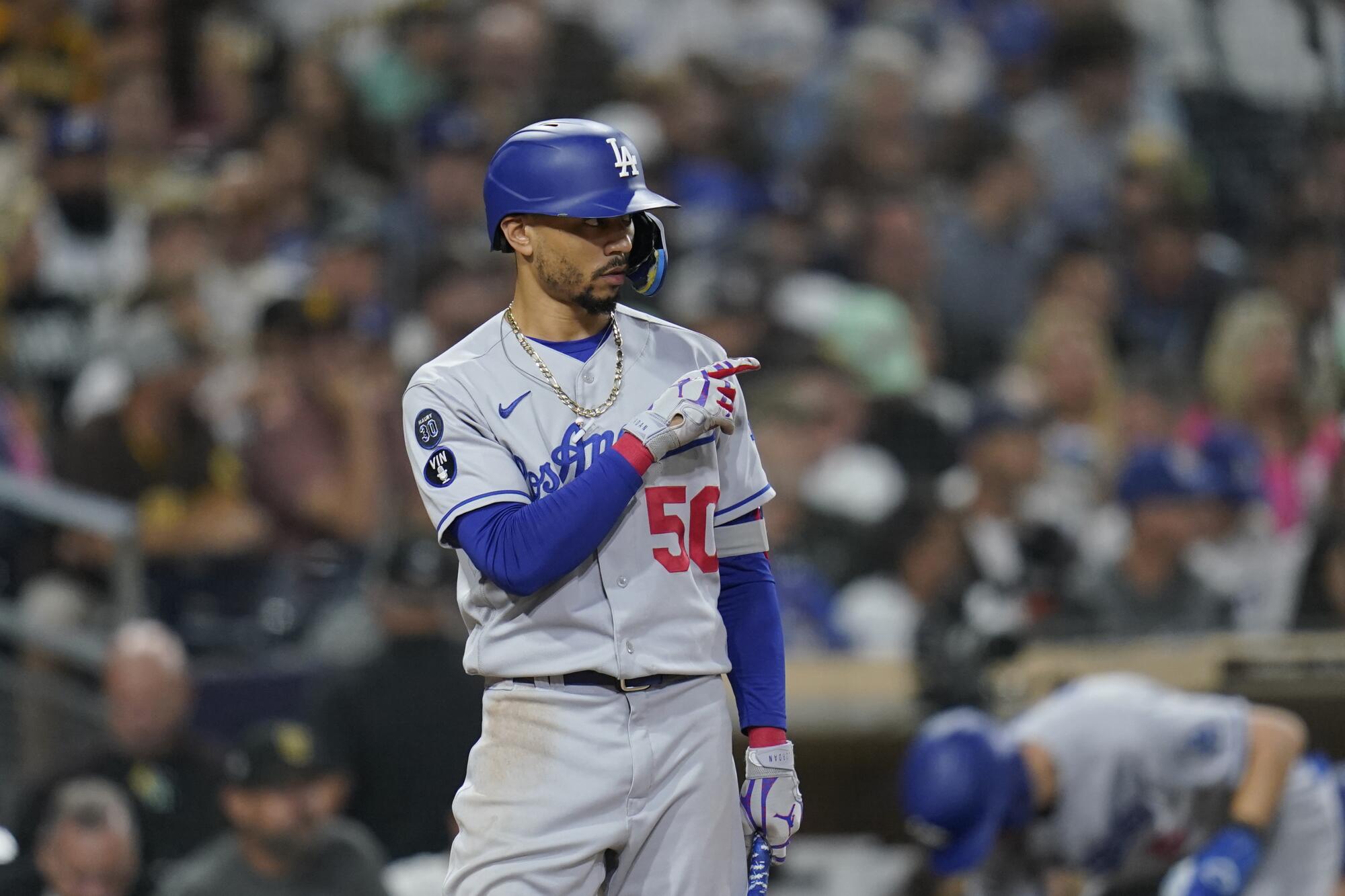 Mookie Betts gestures while batting against the San Diego Padres on Sept. 28.