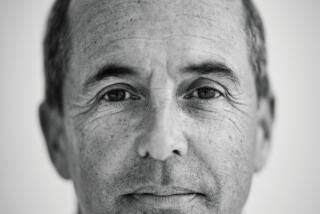 A black and white photo of Don Winslow looking into the camera.