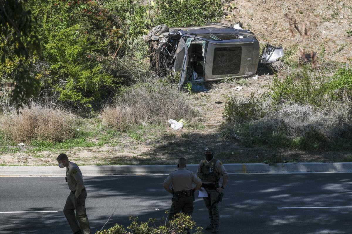 The SUV driven by Tiger Woods at the time of his crash in Rancho Palos Verdes on Tuesday morning rests on its side.