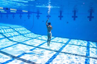 Fernando Tatis Jr. sinks to the bottom of the pool, part of his offseason training regimen.