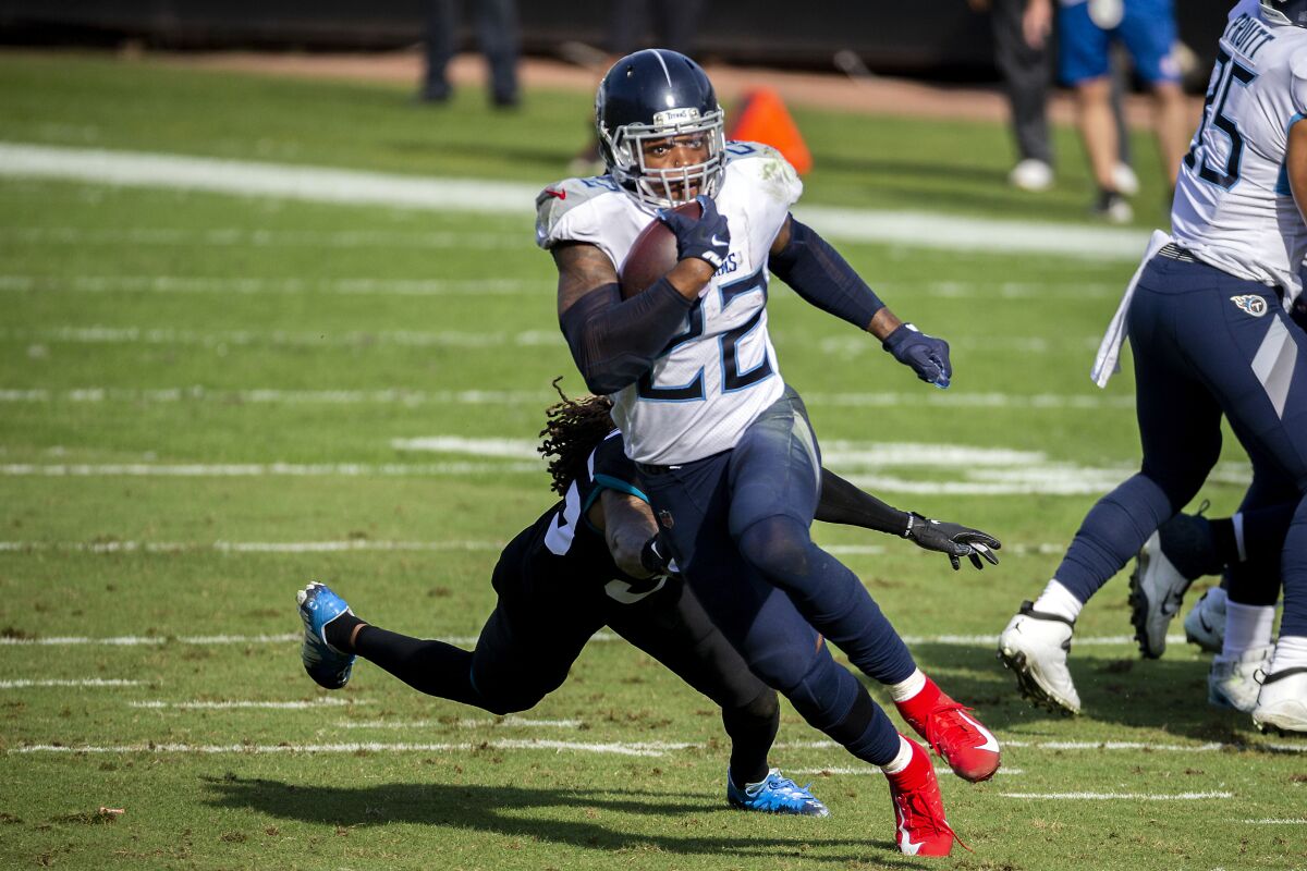 Tennessee Titans running back Derrick Henry runs with the ball against the Jacksonville Jaguars.
