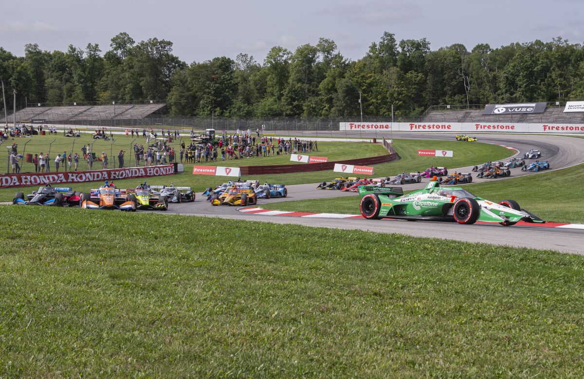 Colton Herta (88) holds the lead early at an IndyCar Series auto race at Mid-Ohio Sports Car Course, Sunday, Sept. 13, 2020, in Lexington, Ohio. (AP Photo/Phil Long)