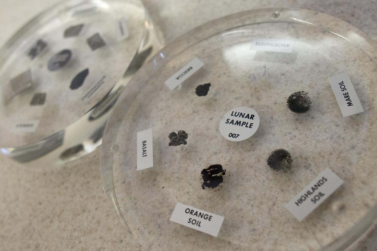 The lunar sample right, and meteorite sample, left, in disc packages, were collected during NASA's Apollo program, which lasted from October 1961 until December 1972. The samples were on display in Bill Matheny's oceanography class at Edison High School in Huntington Beach on Thursday.