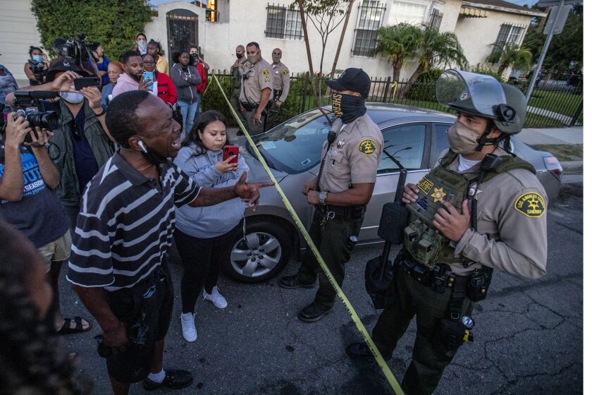 Los Angeles, CA, August 31, 2020. Residents face off with Sheriff's deputies hours after killing Dijon Kizzee in South LA. (Robert Gauthier / Los Angeles Times)