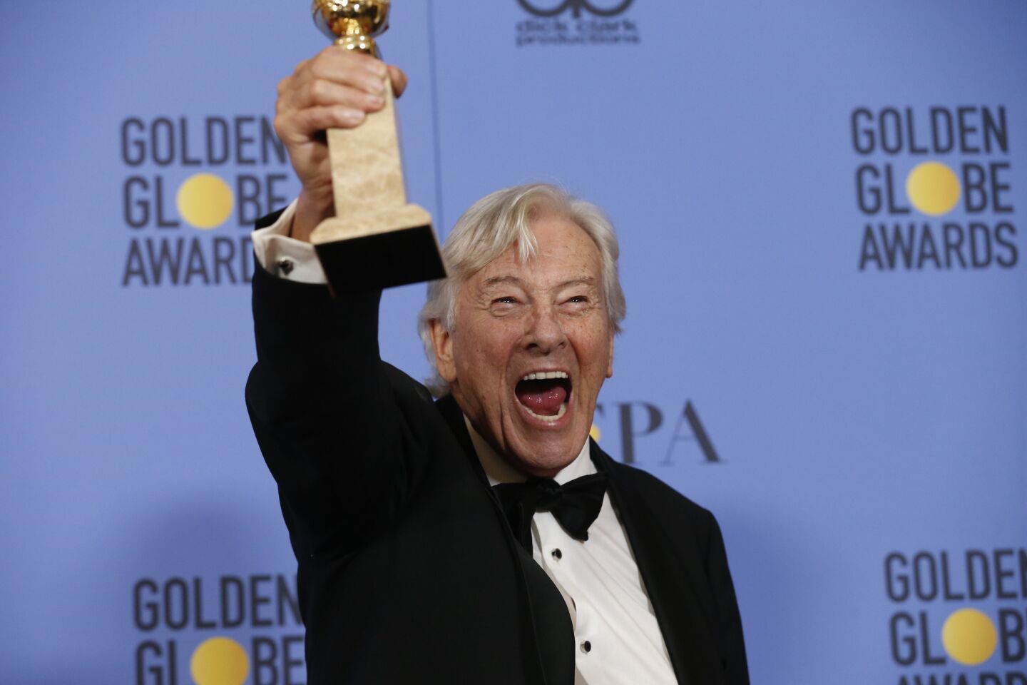 Director Paul Verhoeven with his award for foreign-language film for "Elle."