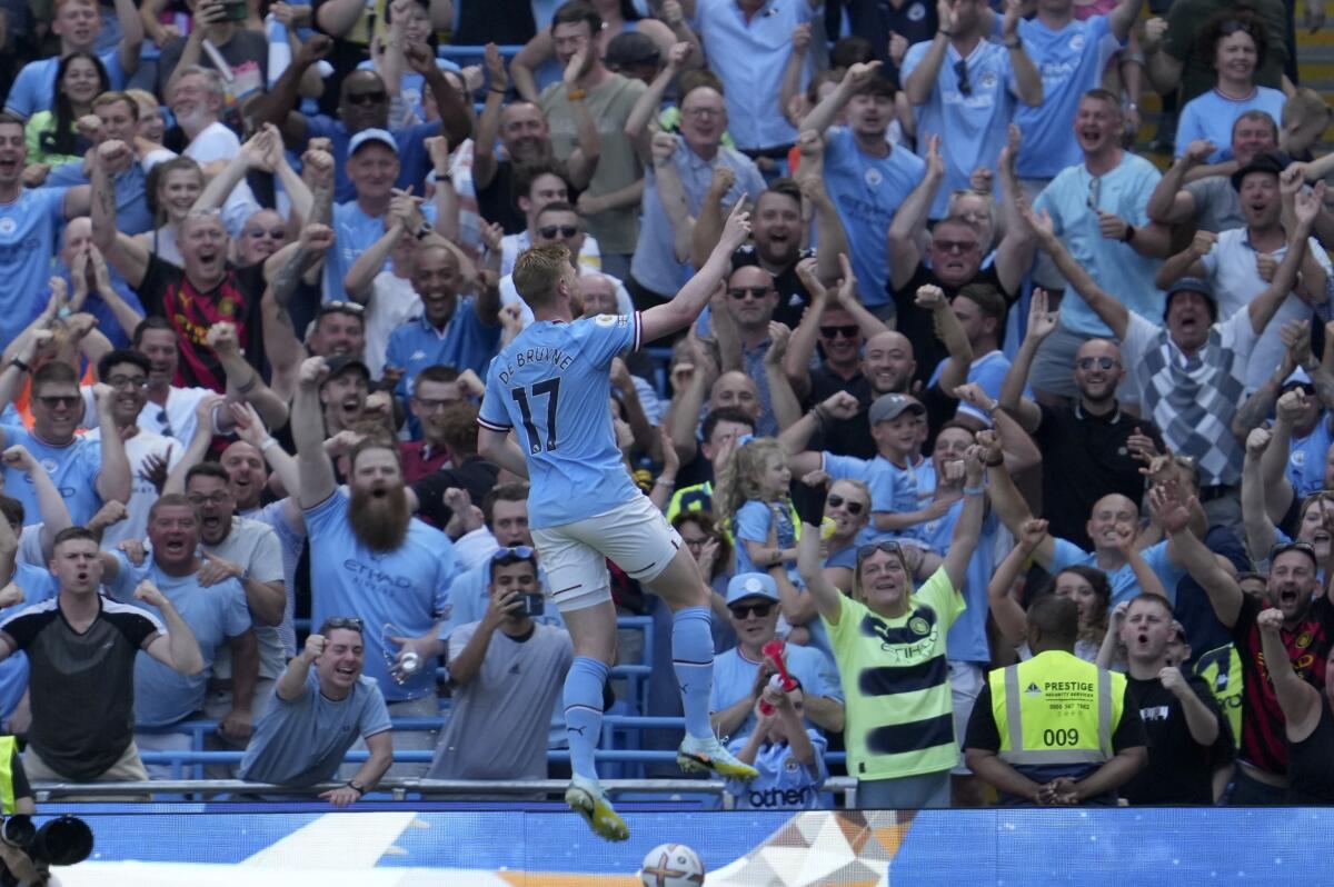 Manchester City's Kevin De Bruyne celebrates after scoring his side's second goal during the English Premier League soccer match between Manchester City and Bournemouth at Etihad stadium in Manchester, England, Saturday, Aug. 13, 2022. (AP Photo/Jon Super)
