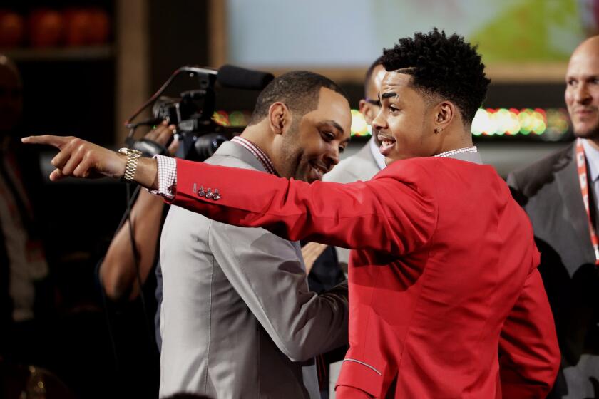 Point guard D'Angelo Russell points to the crowd at Barclays Center after he was selected by the Lakers with the No. 2 overall pick in the 2015 NBA Draft.