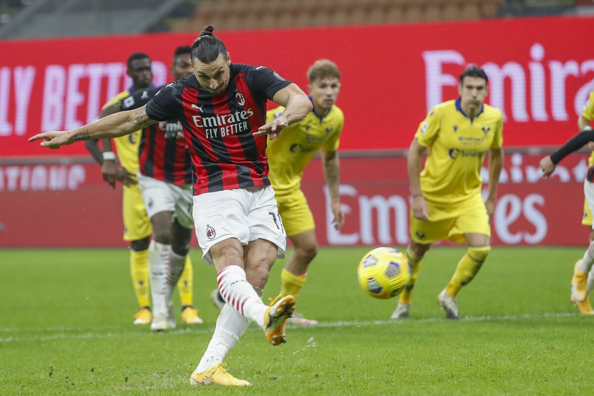 AC Milan's Zlatan Ibrahimovic follows through on a penalty kick against Hellas Verona on Sunday.