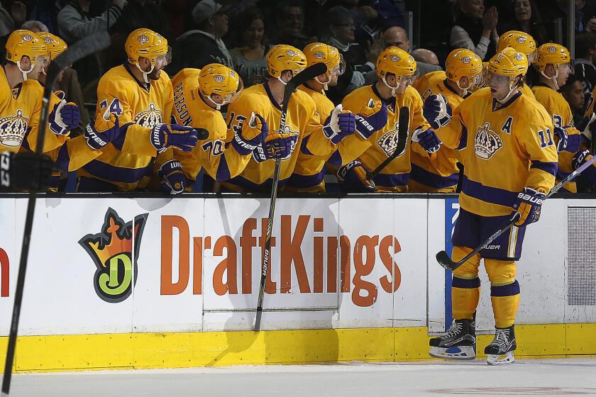 Kings forward Anze Kopitar celebrates with his teammates after scoring a goal on the Flames during the second period of a game on Feb. 23 at Staples Center.