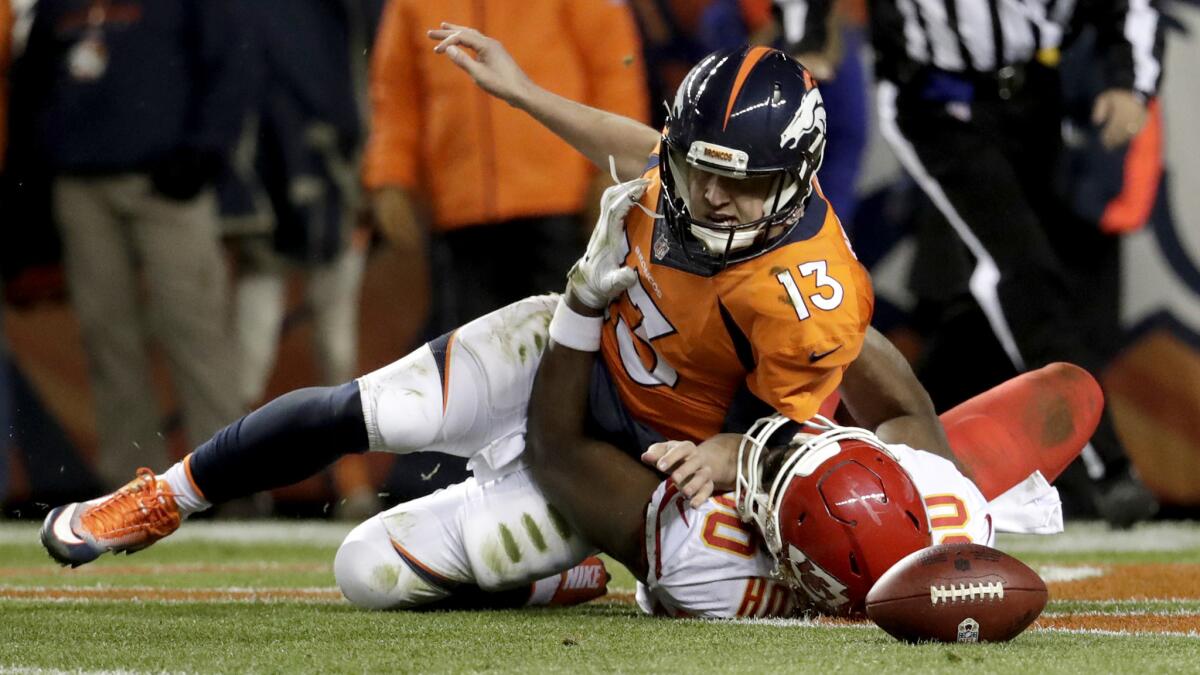 Broncos quarterback Trevor Siemian is sacked by Chiefs linebacker Justin Houston for a safety during their game Sunday.