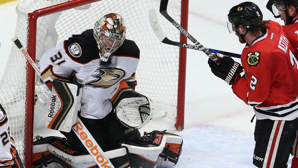 Ducks goalie Frederik Andersen, left, makes a save in front of Chicago Blackhawks defenseman Duncan Keith during the third period of the Ducks' 2-1 win in Game 3 of the Western Conference finals on Thursday.