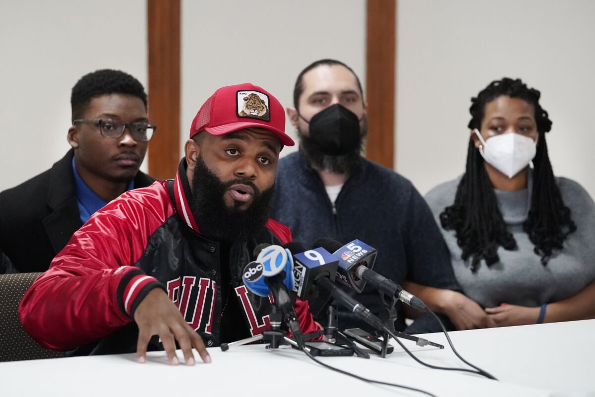 William Calloway speaks during a news conference Friday, Feb. 4, 2022, with other community organizers, the day after their civil disobedience and arrests at the Dirksen Federal Building in Chicago. Calloway and others continue to call for federal charges against a former police officer Jason Van Dyke, who left prison on Thursday after serving less than half of his nearly seven-year sentence for killing Black teenager Laquan McDonald. (AP Photo/Charles Rex Arbogast)