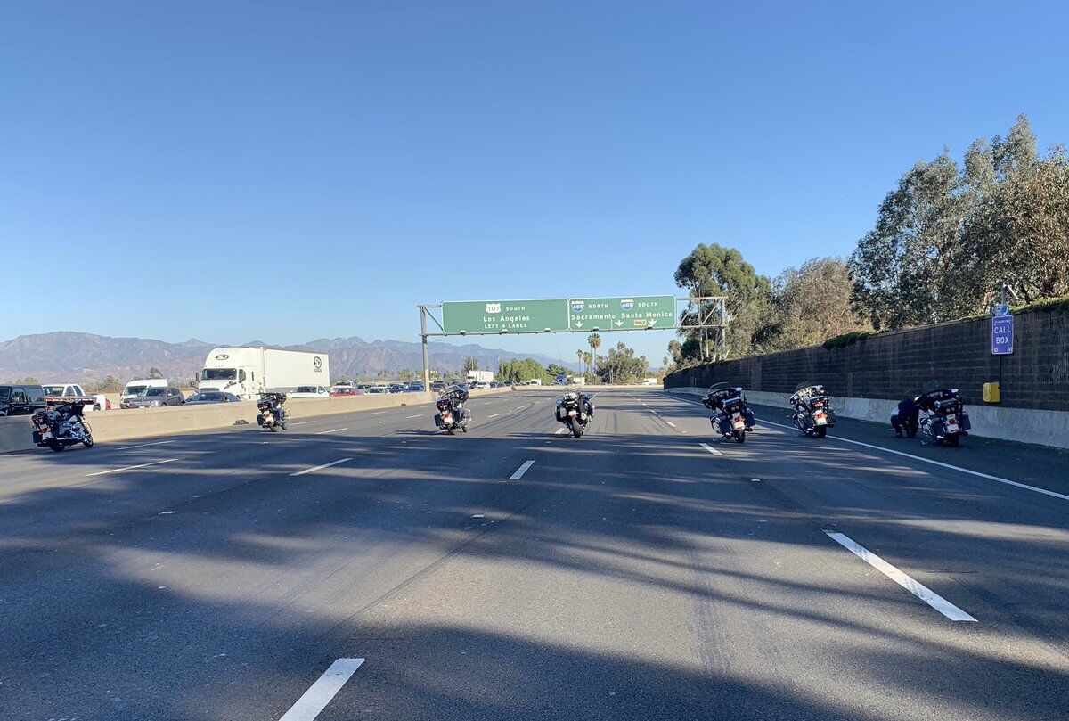 Police motorcycles parked on a shut-down freeway