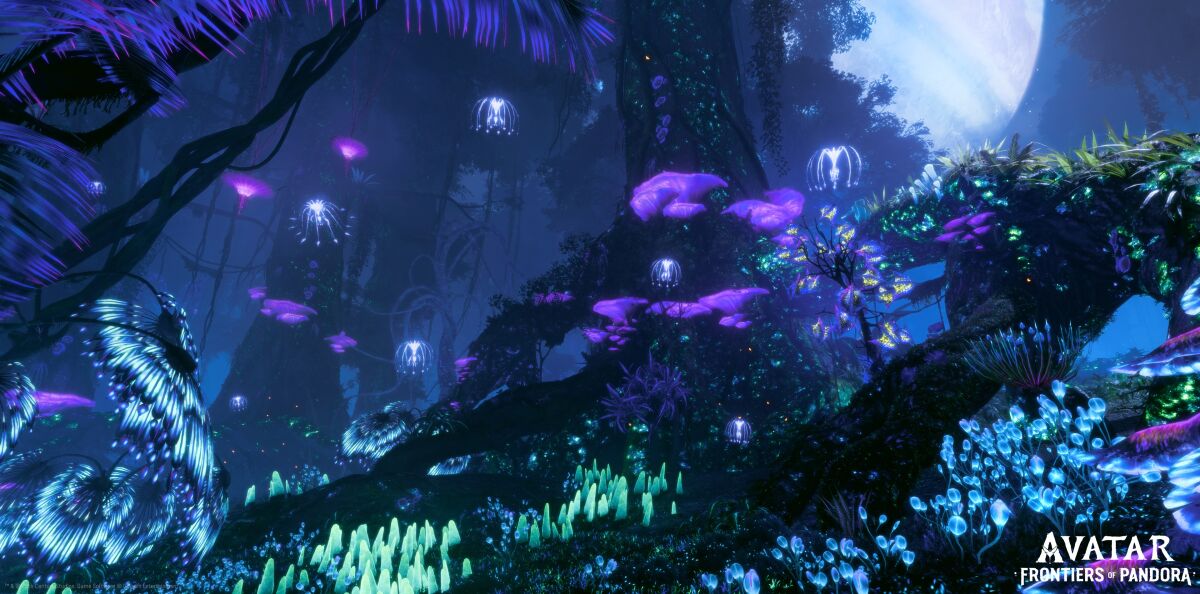 A bluish world full of glowing plants and blobs.