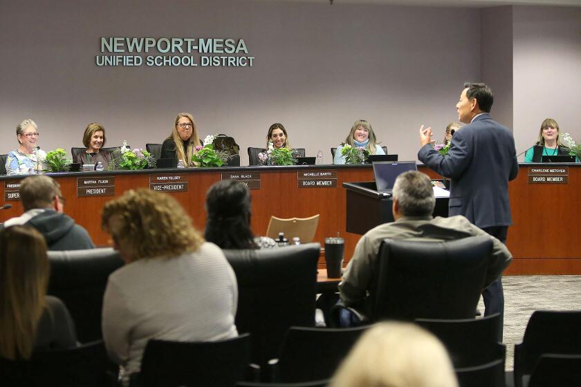 Russell Lee-Sung, Deputy Superintendent of Newport-Mesa Unified School District, addresses the NMUSD board and members of the on coronavirus protocols during meeting on Wednesday.