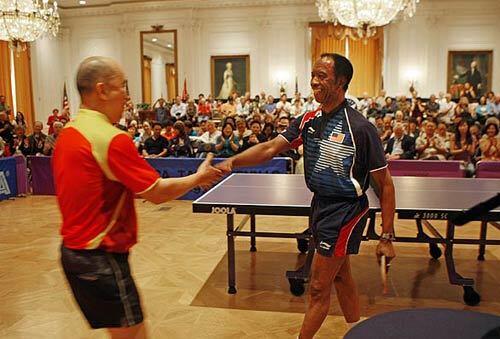 Chinese pingpong champion Liang Geliang congratulates U.S. competitor George Braithwaite after their match Thursday at the Richard Nixon Library & Birthplace in Yorba Linda.